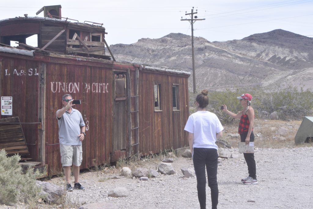 Taking photos of each other at the rail car in Rhyolite